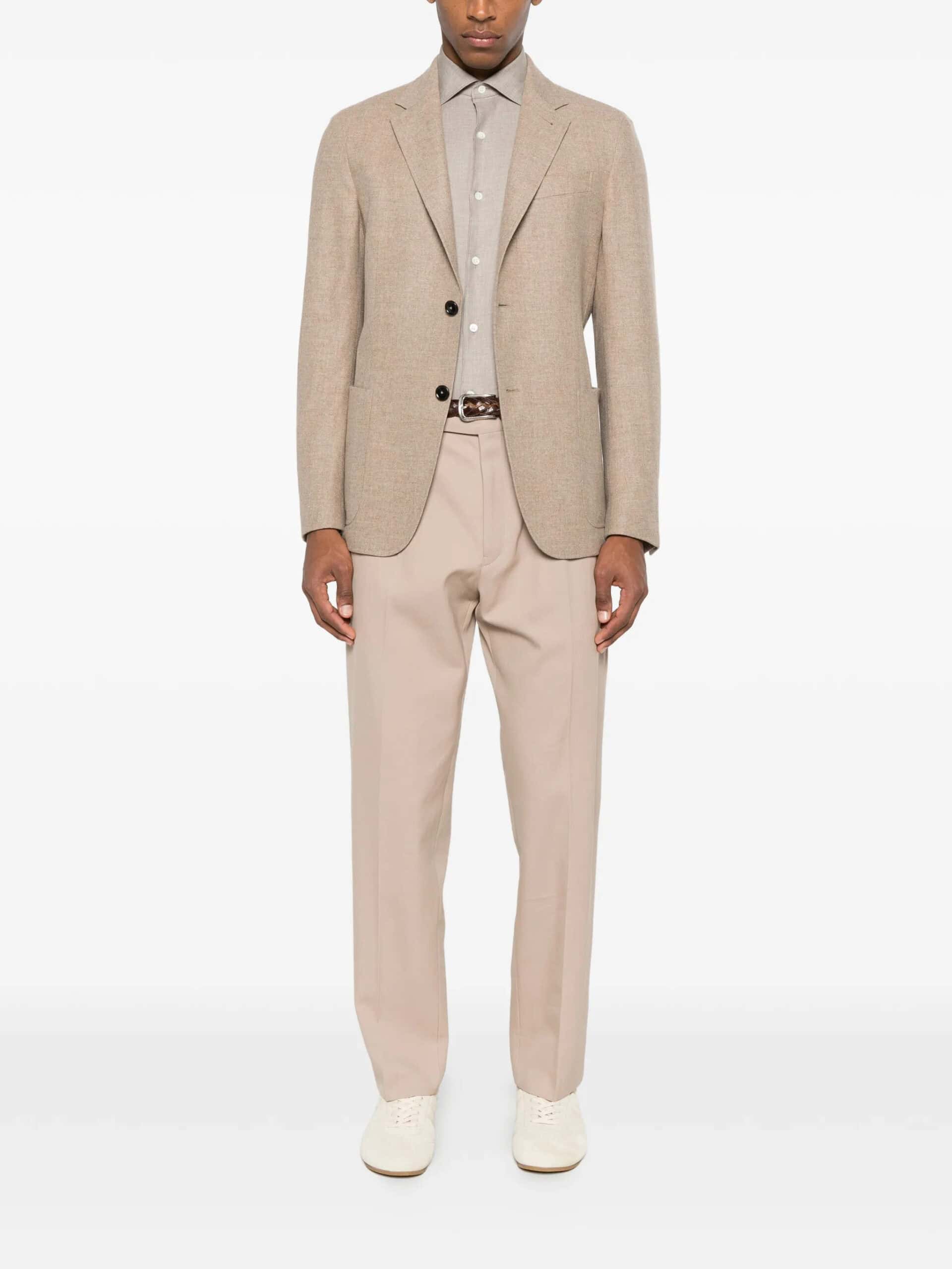 Urban men's smart casual beige outfit with tailored blazer, shirt, and trousers for stylish fashion.